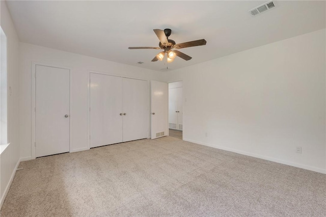 unfurnished bedroom featuring visible vents, baseboards, and carpet floors