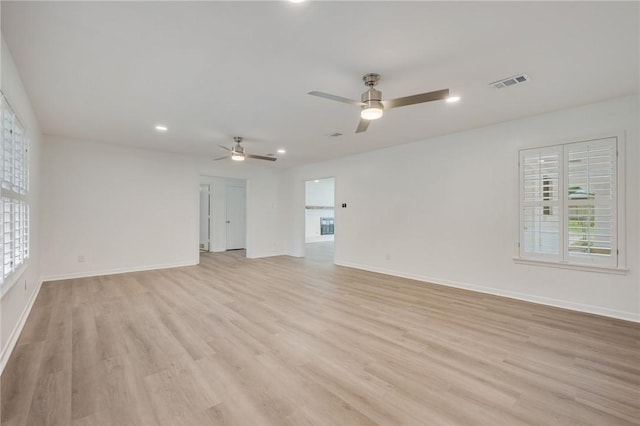 unfurnished living room featuring light wood-style flooring, visible vents, ceiling fan, baseboards, and recessed lighting