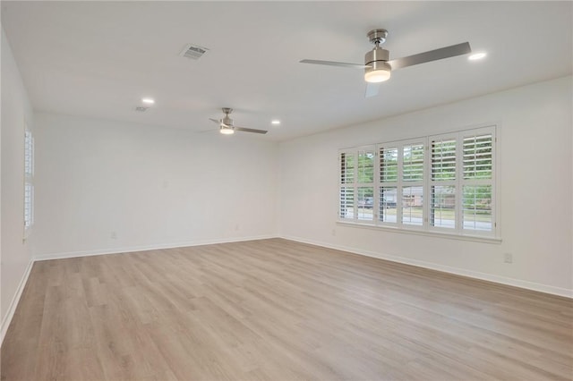 spare room with light wood-style flooring, visible vents, baseboards, recessed lighting, and a ceiling fan