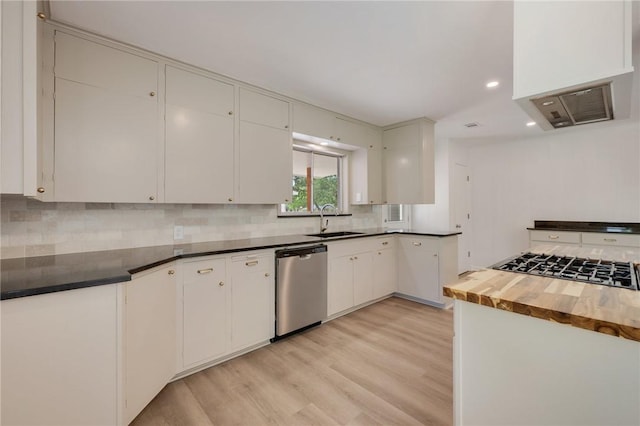 kitchen featuring white cabinetry, decorative backsplash, a sink, dishwasher, and light wood finished floors