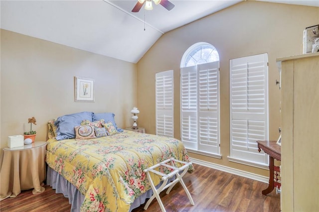 bedroom with vaulted ceiling, wood finished floors, and ceiling fan