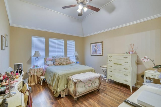 bedroom with ceiling fan, lofted ceiling, wood finished floors, and ornamental molding