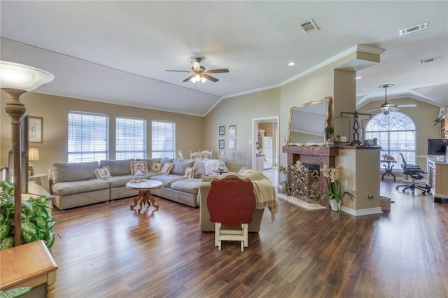 living room featuring visible vents, ceiling fan, and vaulted ceiling