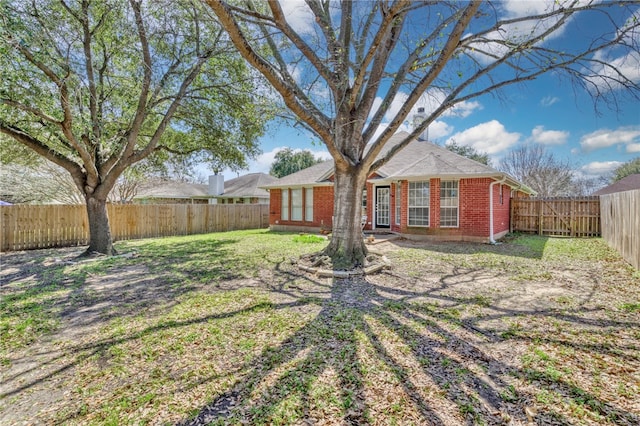 exterior space featuring a fenced backyard