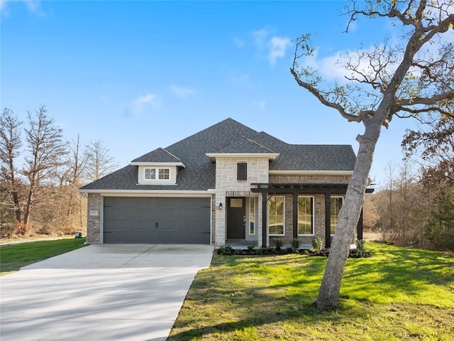 view of front facade featuring a front yard and a garage