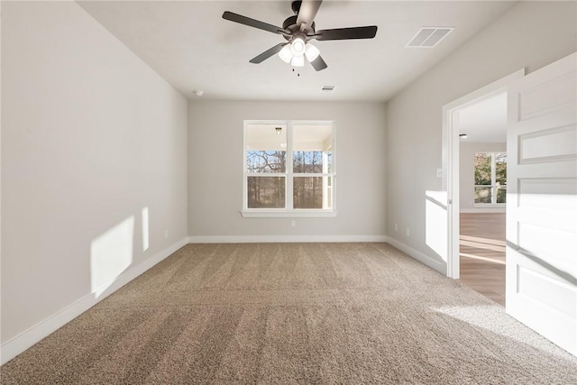 unfurnished room with carpet flooring and ceiling fan