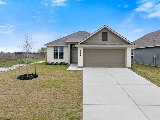 single story home featuring a garage and a front lawn