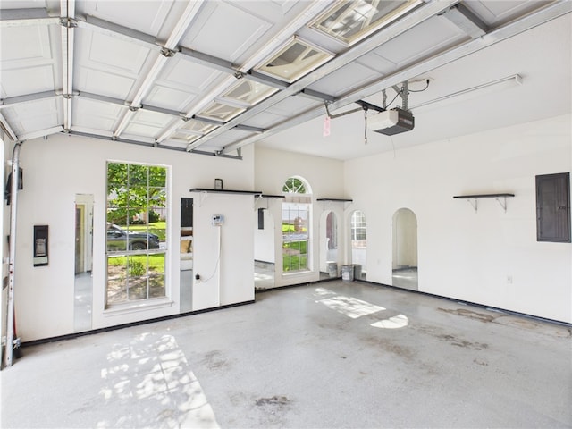 5614 Thomas Nelson Dr, Tyler, TX 75707 - garage with electric panel and a garage door opener