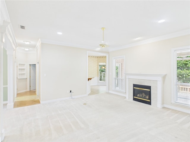 5614 Thomas Nelson Dr, Tyler, TX 75707 - unfurnished living room featuring crown molding, carpet floors, a tiled fireplace, and recessed lighting