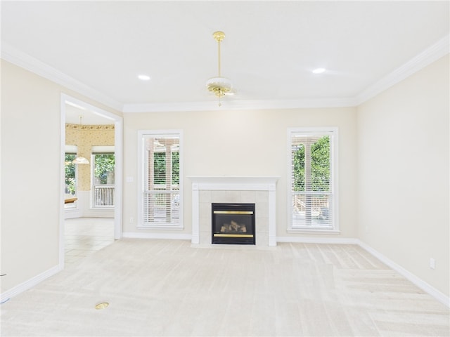 5614 Thomas Nelson Dr, Tyler, TX 75707 - unfurnished living room with carpet, crown molding, a tile fireplace, plenty of natural light, and recessed lighting