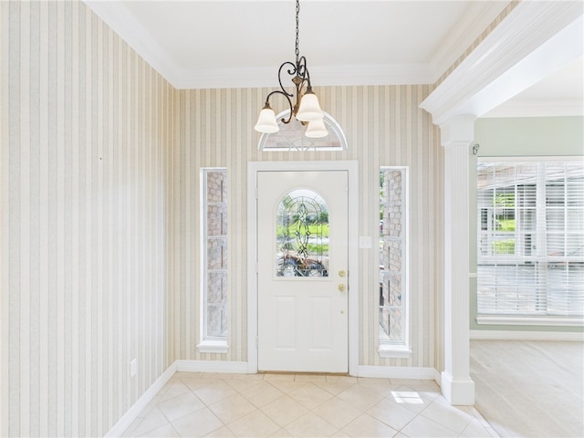 5614 Thomas Nelson Dr, Tyler, TX 75707 - tiled foyer entrance with decorative columns, a chandelier, ornamental molding, wallpapered walls, and healthy amount of natural light
