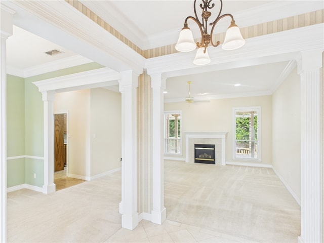 5614 Thomas Nelson Dr, Tyler, TX 75707 - unfurnished living room featuring light carpet, a chandelier, crown molding, a tiled fireplace, and ornate columns