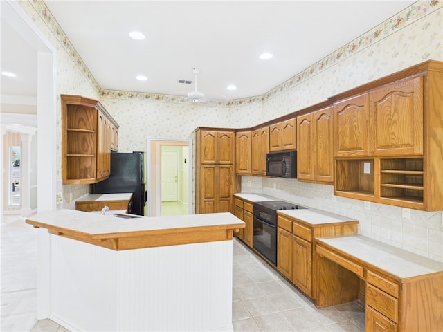 5614 Thomas Nelson Dr, Tyler, TX 75707 - kitchen with open shelves, black appliances, wallpapered walls, a peninsula, and tasteful backsplash
