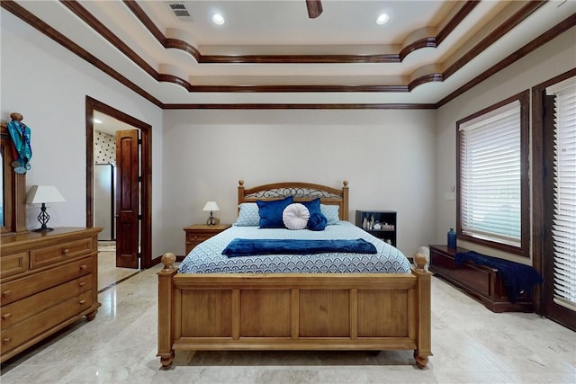 bedroom featuring a raised ceiling, crown molding, visible vents, and ceiling fan