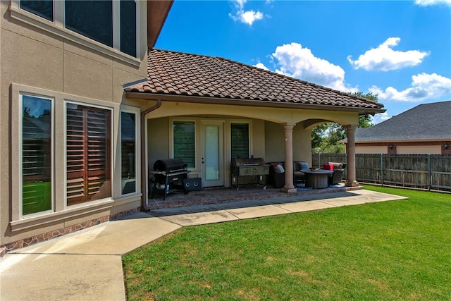 exterior space featuring a grill and fence