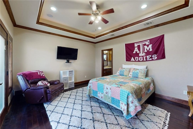 bedroom featuring a raised ceiling, wood finished floors, crown molding, and baseboards