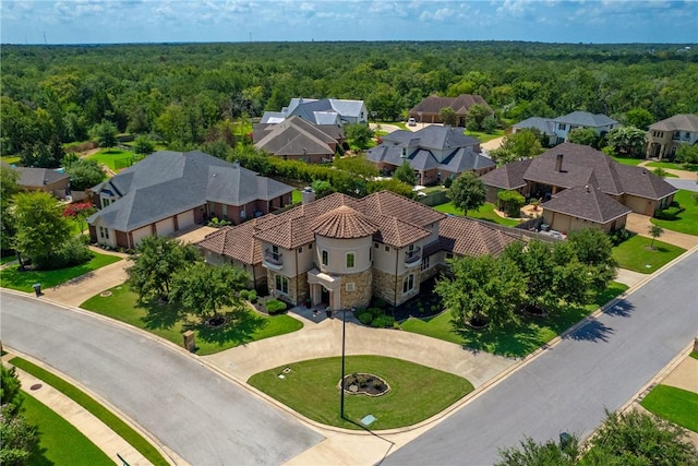 aerial view with a forest view and a residential view