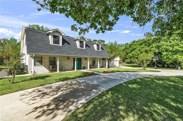 cape cod home with a front yard