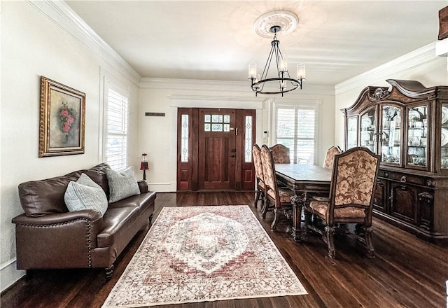 dining room with a chandelier, dark hardwood / wood-style flooring, and crown molding