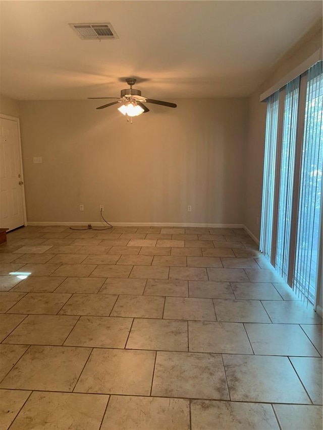 unfurnished room featuring ceiling fan