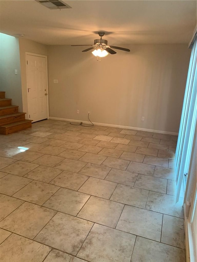 unfurnished room featuring ceiling fan