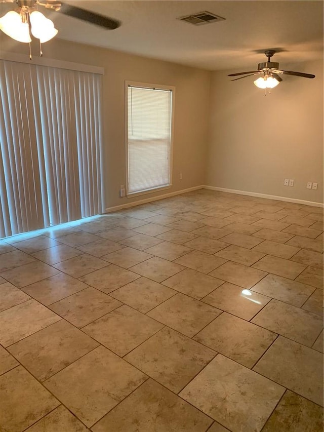 spare room with ceiling fan