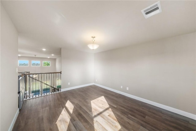 empty room featuring dark hardwood / wood-style floors