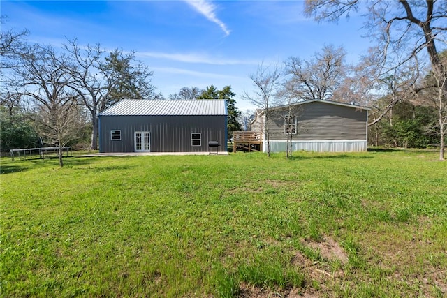 view of yard featuring french doors