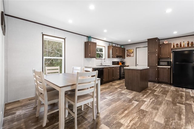 dining room with recessed lighting, dark wood-style floors, and ornamental molding