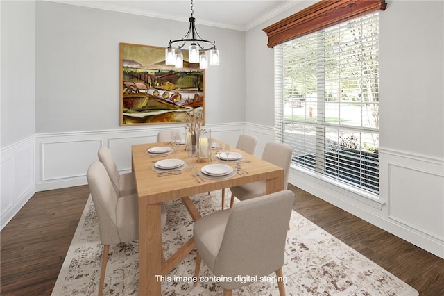 dining area with a chandelier, dark hardwood / wood-style floors, and ornamental molding