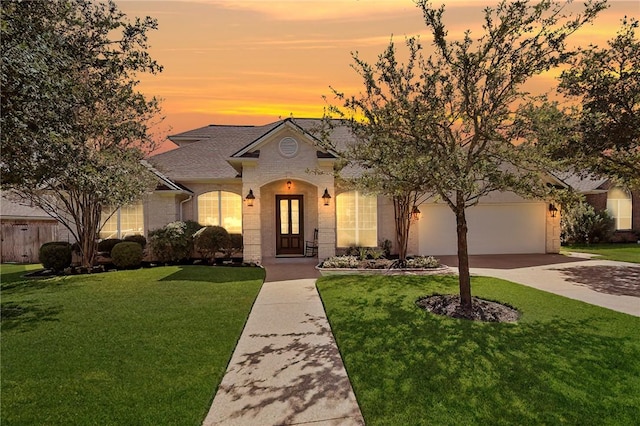 view of front of property with a lawn