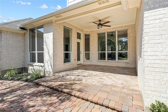 view of patio featuring ceiling fan