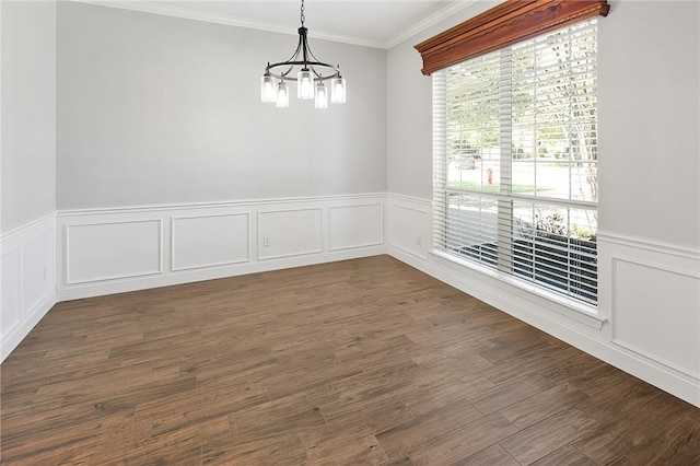 unfurnished dining area featuring a chandelier, dark hardwood / wood-style floors, and ornamental molding