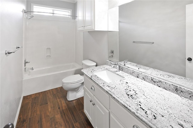 full bathroom featuring hardwood / wood-style flooring, vanity, shower / bathtub combination, and toilet