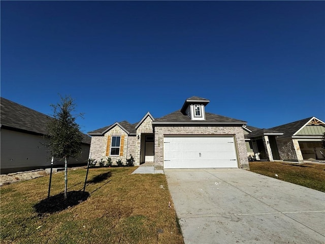 view of front of house with a front lawn and a garage