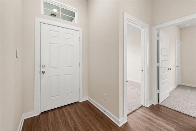 carpeted spare room with ceiling fan and vaulted ceiling