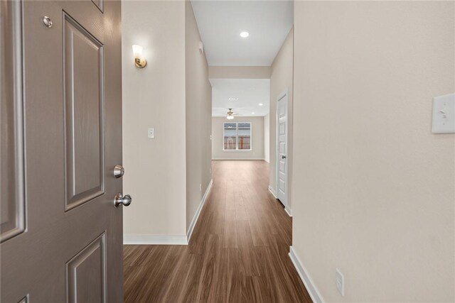 kitchen with stainless steel dishwasher, dark hardwood / wood-style floors, sink, and decorative light fixtures