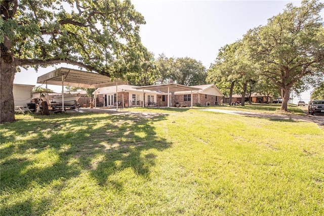 885 7th St, Somerville, TX 77879 - view of green lawn featuring a carport