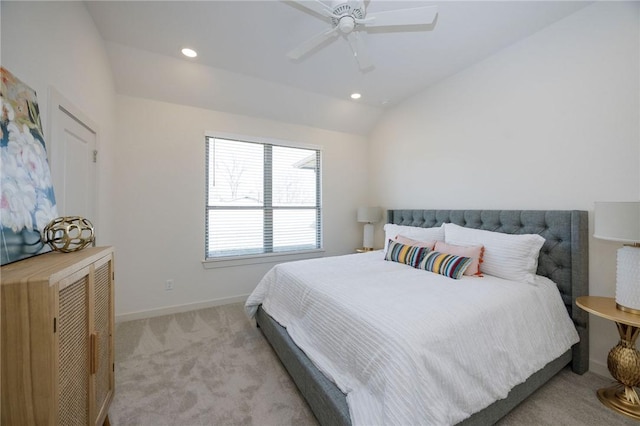 carpeted bedroom featuring ceiling fan and vaulted ceiling