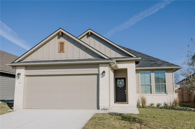 view of front of property with a garage and a front lawn