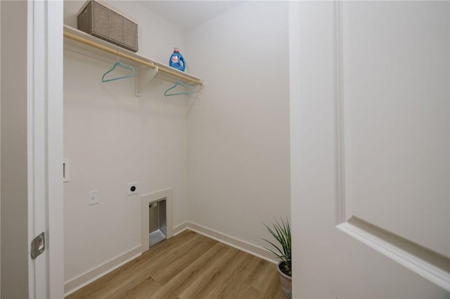 washroom with electric dryer hookup and light wood-type flooring