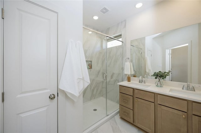 bathroom with vanity and an enclosed shower