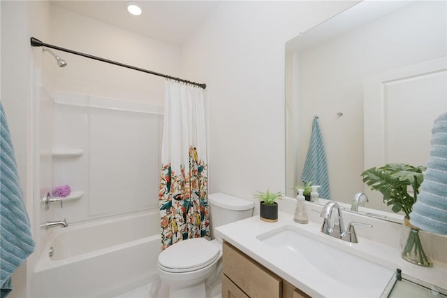 full bathroom featuring shower / bath combo, vanity, and toilet