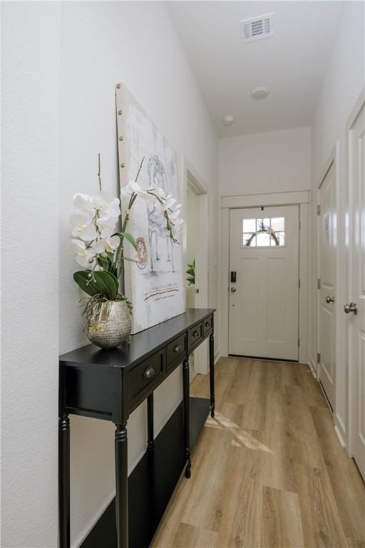 entryway with light hardwood / wood-style flooring