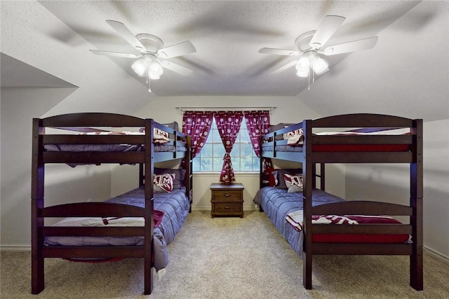 bedroom with vaulted ceiling, baseboards, ceiling fan, and carpet flooring