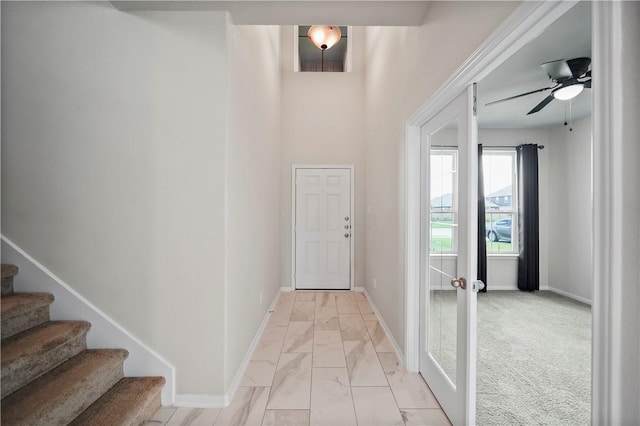 interior space featuring ceiling fan and french doors