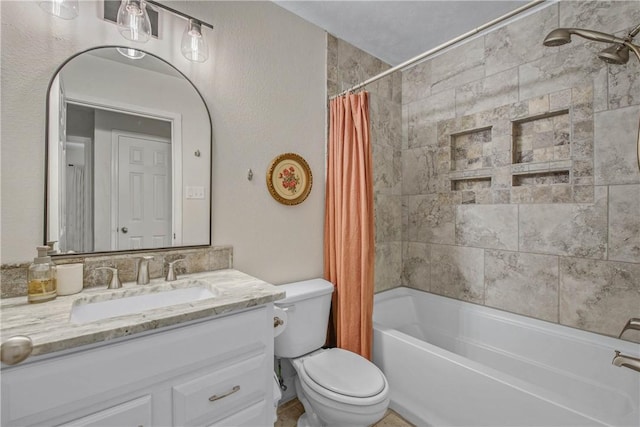 full bathroom featuring vanity, shower / tub combo, and toilet