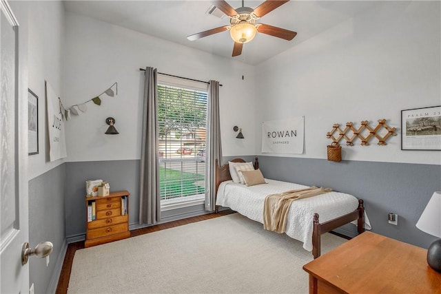 bedroom with hardwood / wood-style flooring and ceiling fan