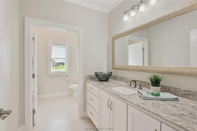 bathroom featuring tile patterned flooring, vanity, and toilet