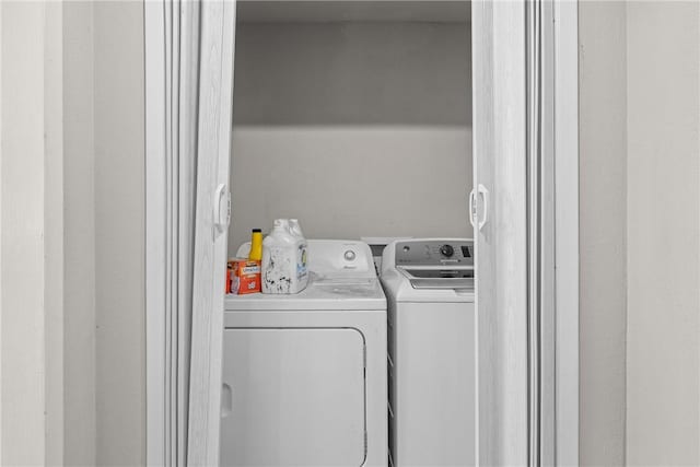 laundry room with laundry area and separate washer and dryer